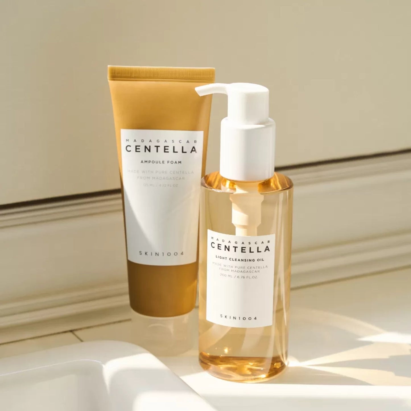 SKIN1004 Madagascar Centella Double Cleansing Duo skincare set with gentle cleansers and natural centella extract bottles.