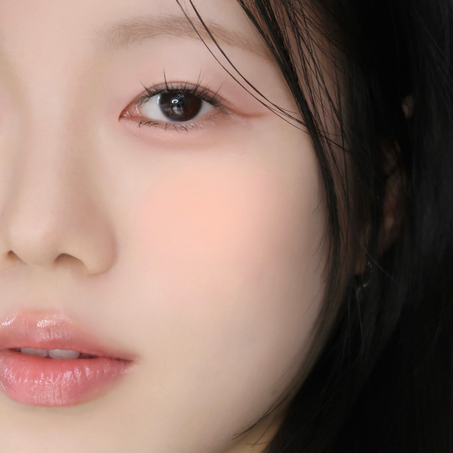 Wakemake Sheer Breeze Blusher in Salmon Coral, soft pink-orange blush with a smooth, natural finish on fair skin.