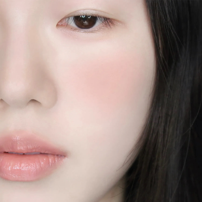 Wakemake Sheer Breeze Blusher in a soft pink shade, showing its smooth, lightweight powder texture in a close-up shot.