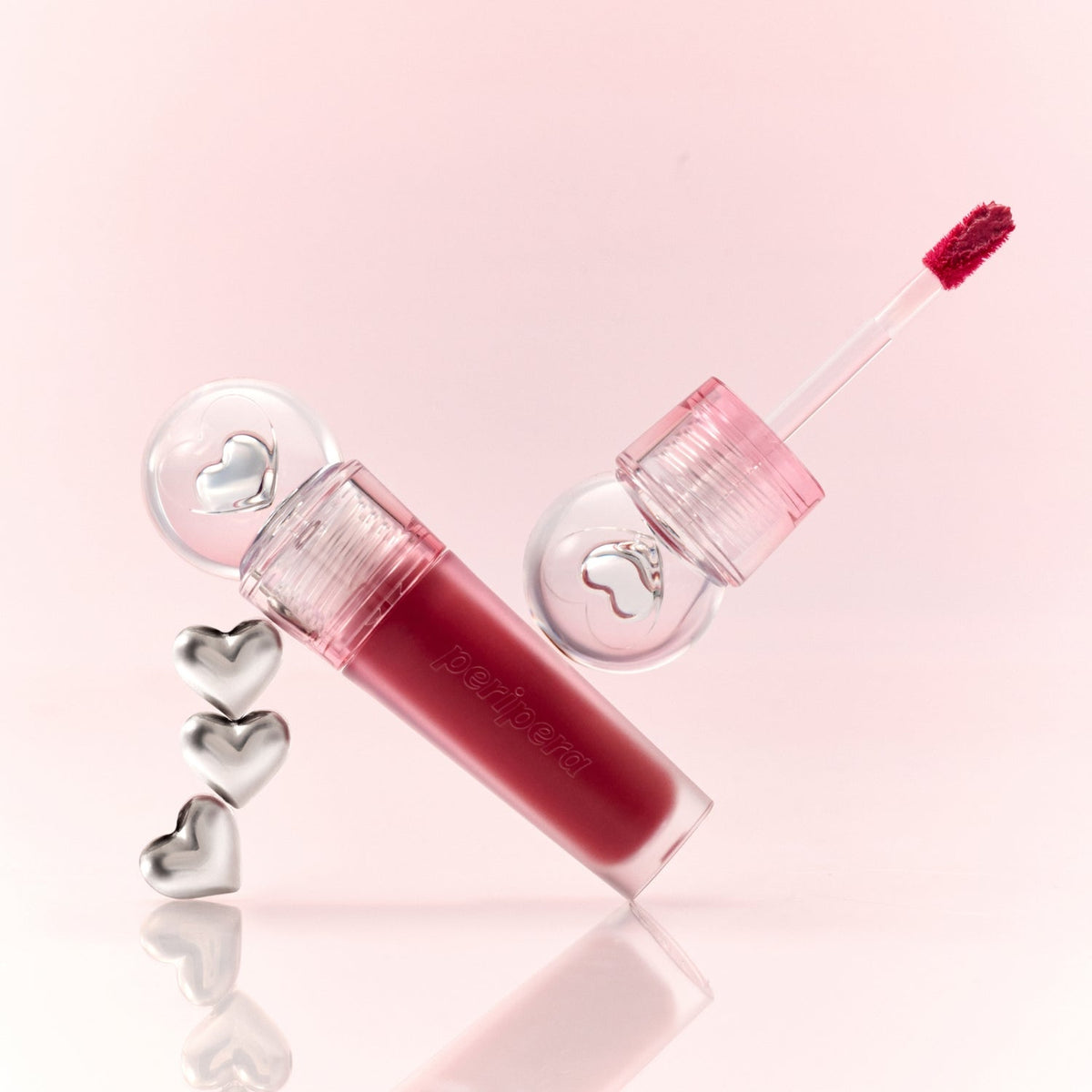 Peripera Ink Jellable Lip Tint in a sleek tube, showcasing its vibrant, glossy lip tint formula with a brush applicator.