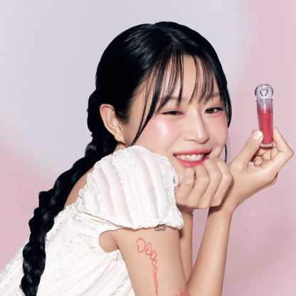 Peripera Ink Jellable Lip Tint in a vibrant shade, showcasing the glossy, jelly-like texture and applicator brush.