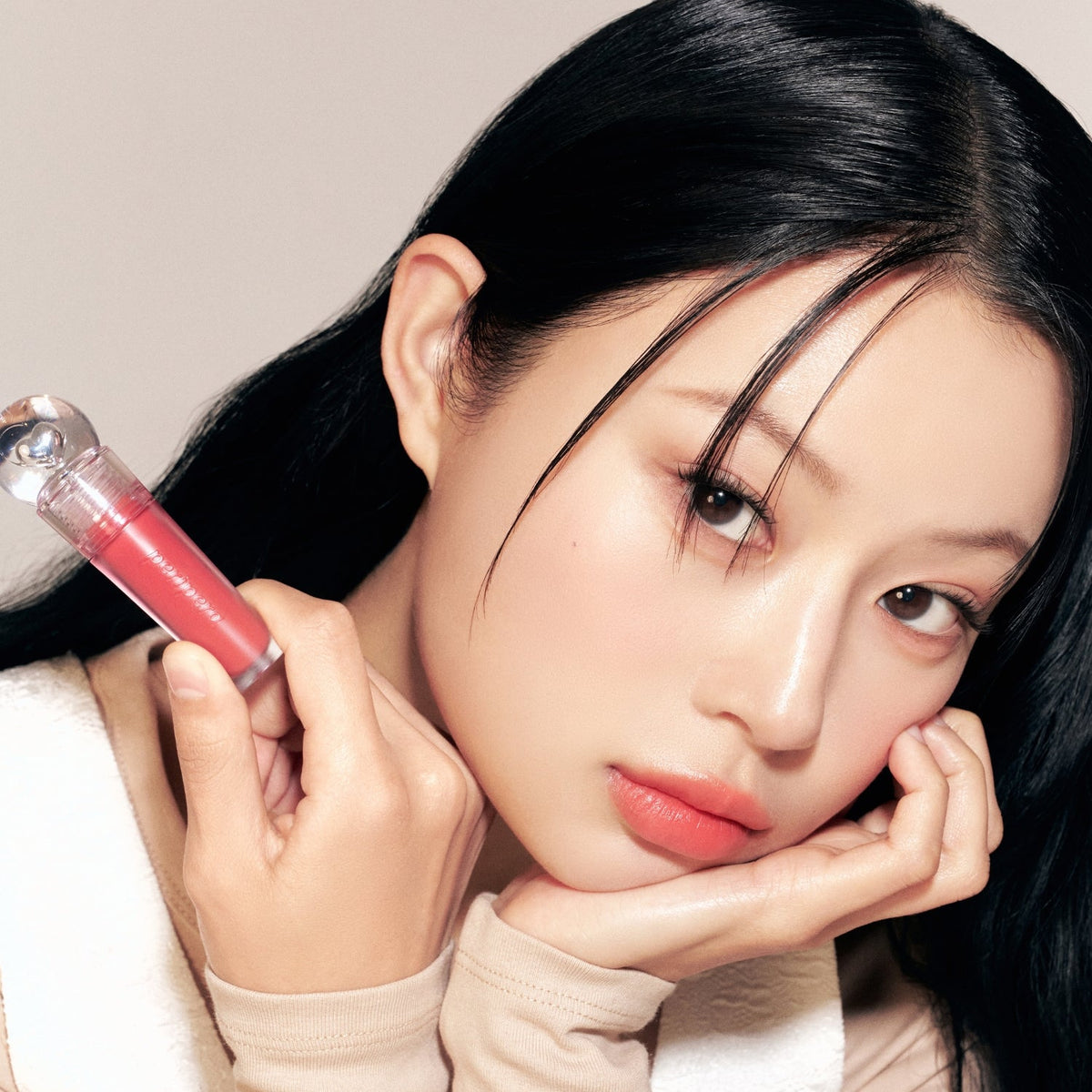 Peripera Ink Jellable Lip Tint in a sleek tube, showcasing vibrant pink shade on a smooth applicator brush.
