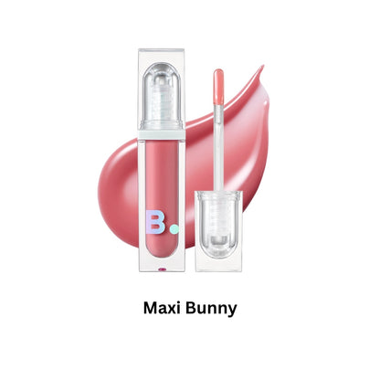 Banila Co B. By Banila Volume Lip Plumper Maxi showing a close-up of the shiny, tinted lip plumper tube with apple-themed packaging