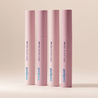 Peripera Ink All Black Cara mascara wand showing densely packed black mascara brush with smooth bristles.