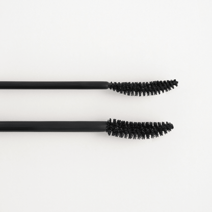 Peripera Ink All Black Cara mascara wand with black mascara formula, showing long, defined lashes for bold eye makeup.