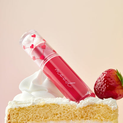 Peripera Ink Mood Glowy Tint in Soft Berry, a lip tint with a glossy finish and soft berry shade, shown on lips.