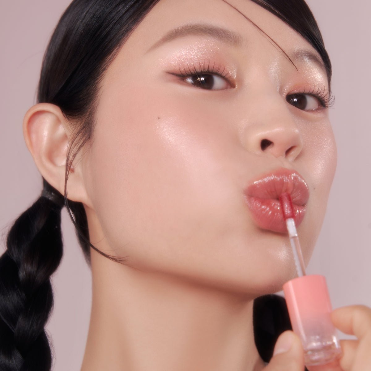 Peripera Ink Mood Glowy Tint lip tint in Tteok Recipe with glossy, vibrant finish, shown on lips in a close-up image.