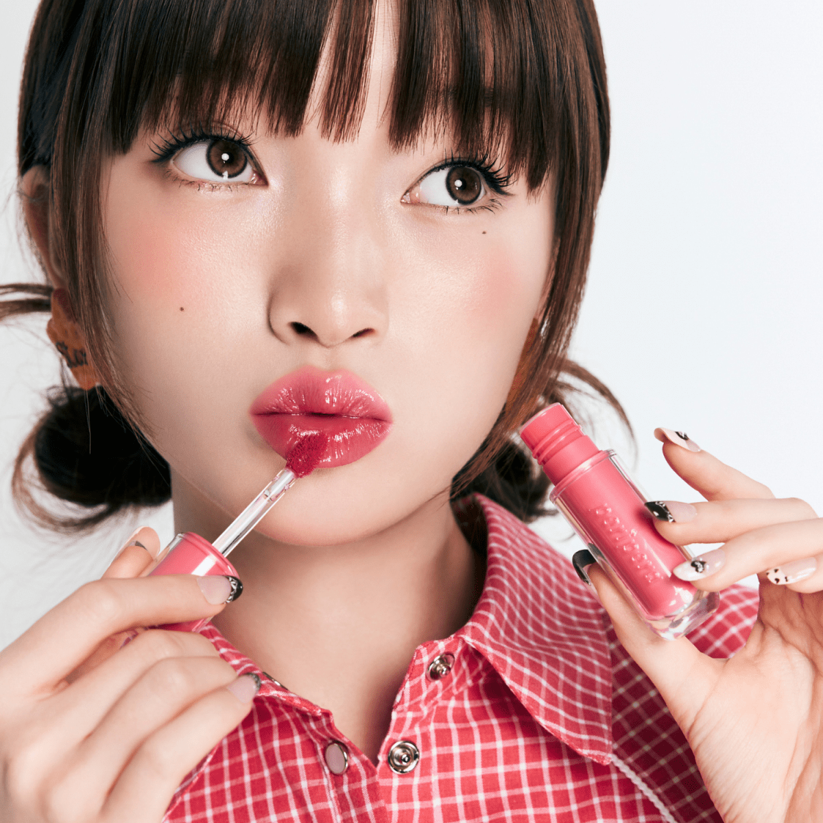 Peripera Mood Glowy Lip Tint in a soft, glossy finish showing a tinted, moisturizing lip color on natural lips.