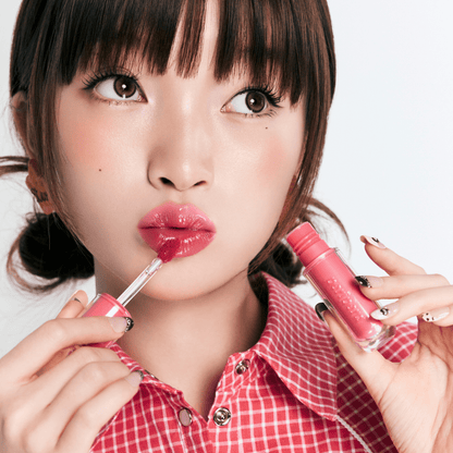 Peripera Mood Glowy Lip Tint in a soft, glossy finish showing a tinted, moisturizing lip color on natural lips.