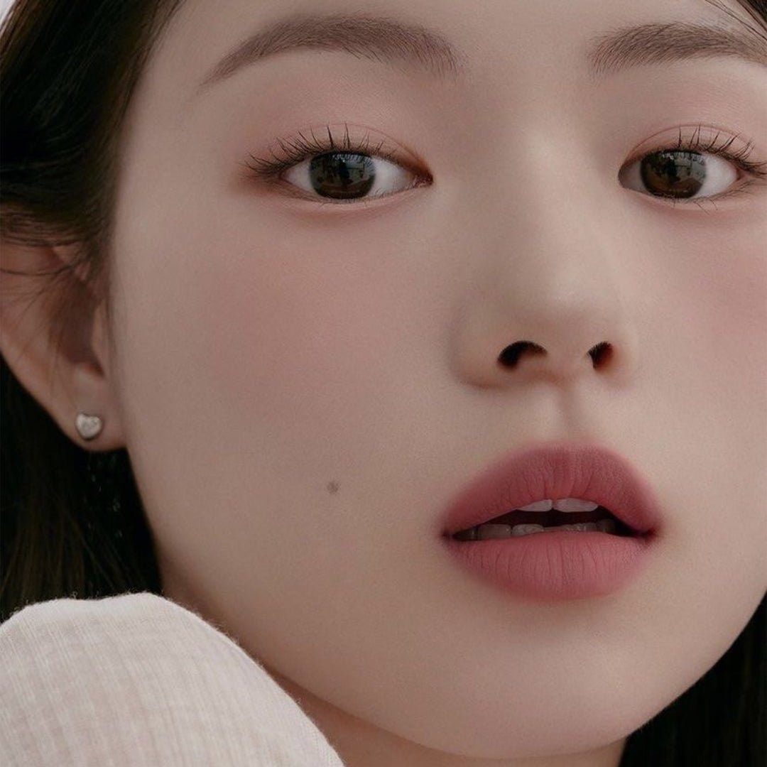 Peripera Slip On My Lip lipstick in a sleek tube, showcasing vibrant pink lipstick color with a smooth, glossy finish.