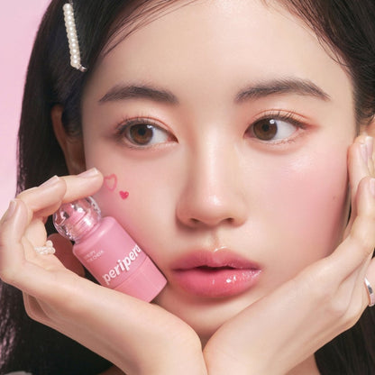 Peripera Syrupy Tok Cheek blush in a creamy, pigmented formula with a soft, glossy finish applied to cheek area.