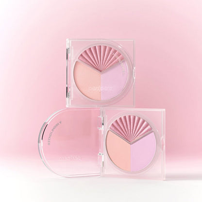 Peripera V Highlighter with shimmering pink and pearlescent finish, showcasing a sleek compact and applicator brush for highlighting.